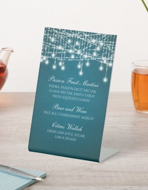 White Twinkle String Lights on Teal Pedestal Sign