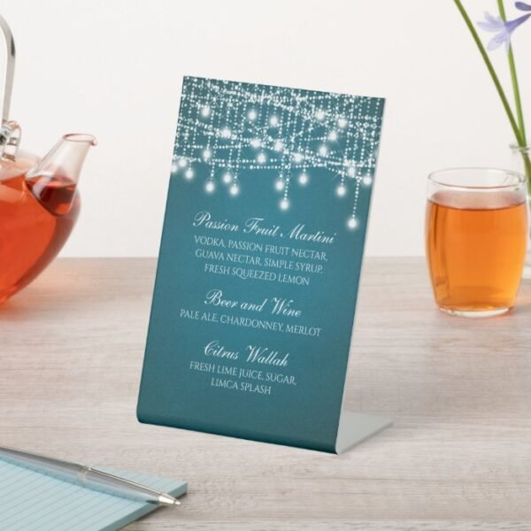 White Twinkle String Lights on Teal Pedestal Sign